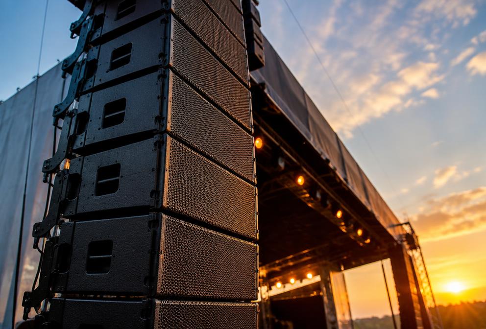 Mixing console and PA speakers set up for an event sound system